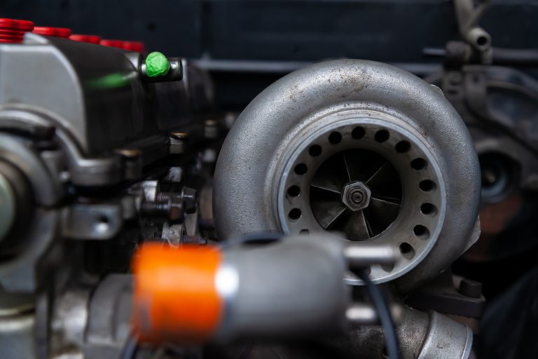 Turbo charger installed on car engine for power booster torque drive. Auto service industry for racing.